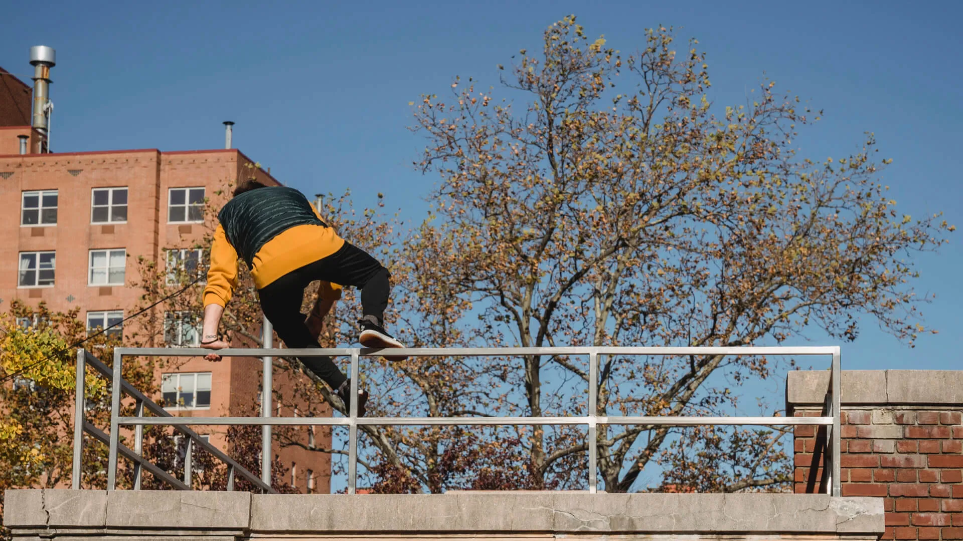 A picture of someone jumping a fence
